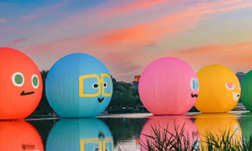 Floating character ball inflatables installation on lake